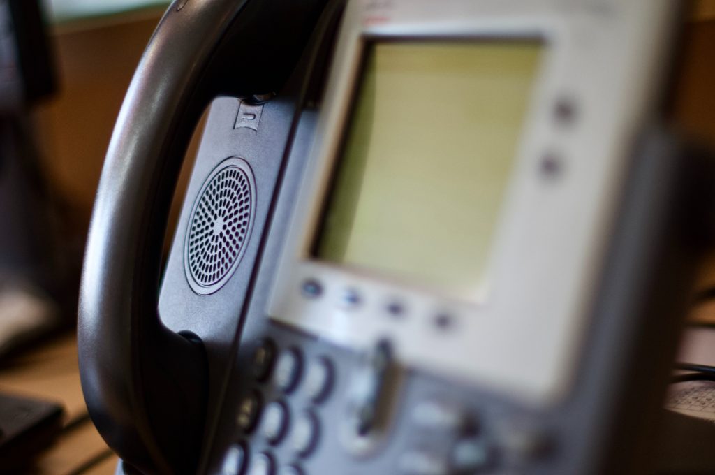Image of an office phone from a slight side view